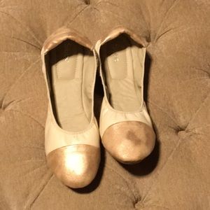 Tan and copper ballet flats with tread